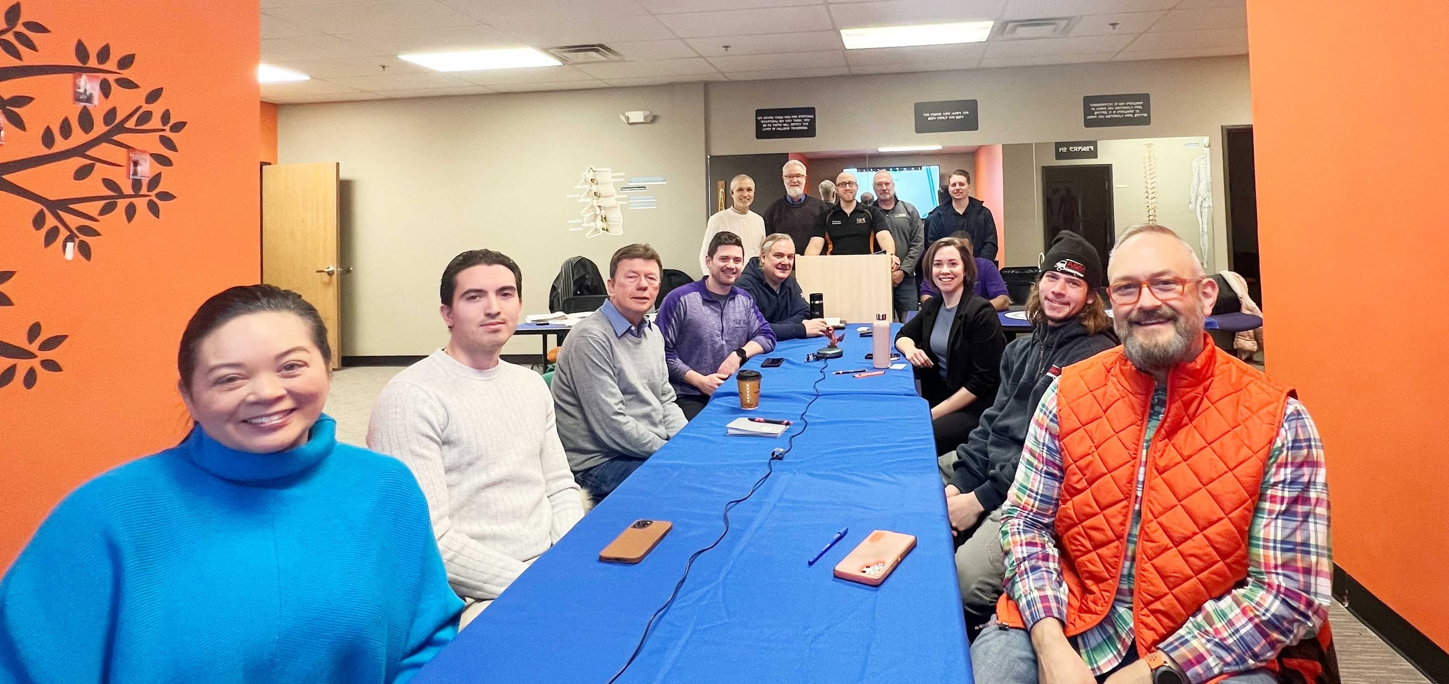 Members of The Referral Exchange around the table at a Wednesday morning meeting